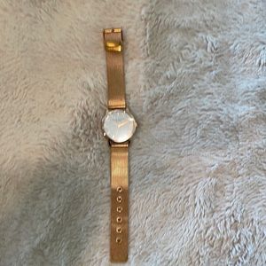 NWOT women’s fashion watch in rose gold. Face still has  protective covering!!
